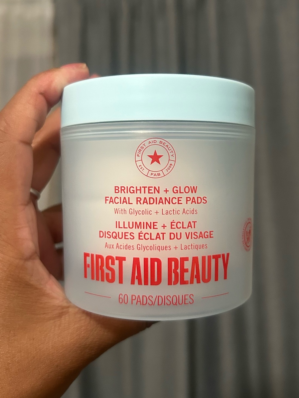 First Aid Beauty Brighten + Glow Facial Radiance Pads — Light Blue & White Jar